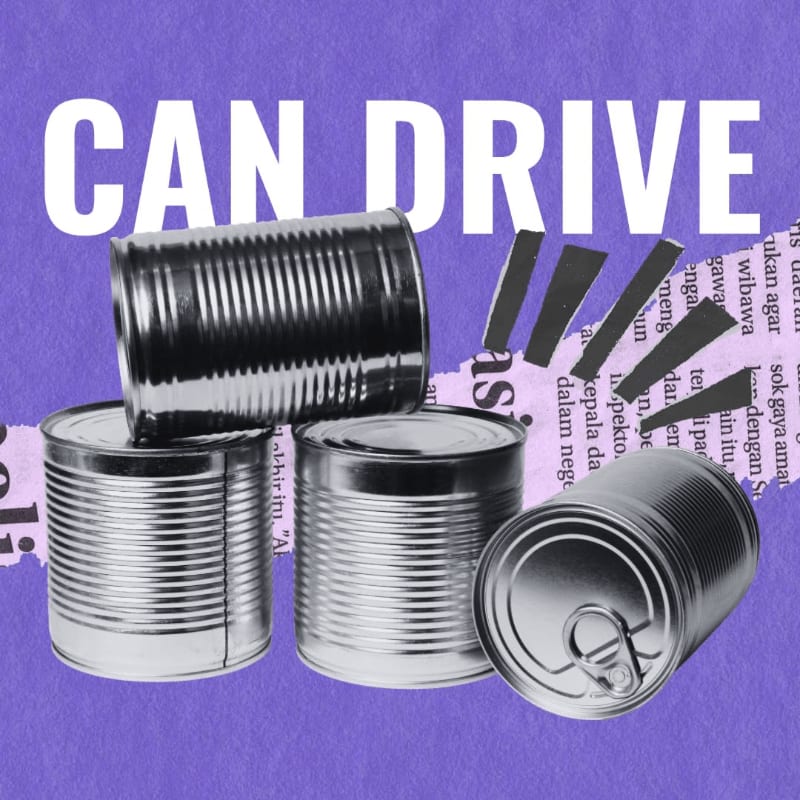 Several silver tin cans are stacked in the foreground against a purple background featuring the text "CAN DRIVE" and torn newspaper scraps.