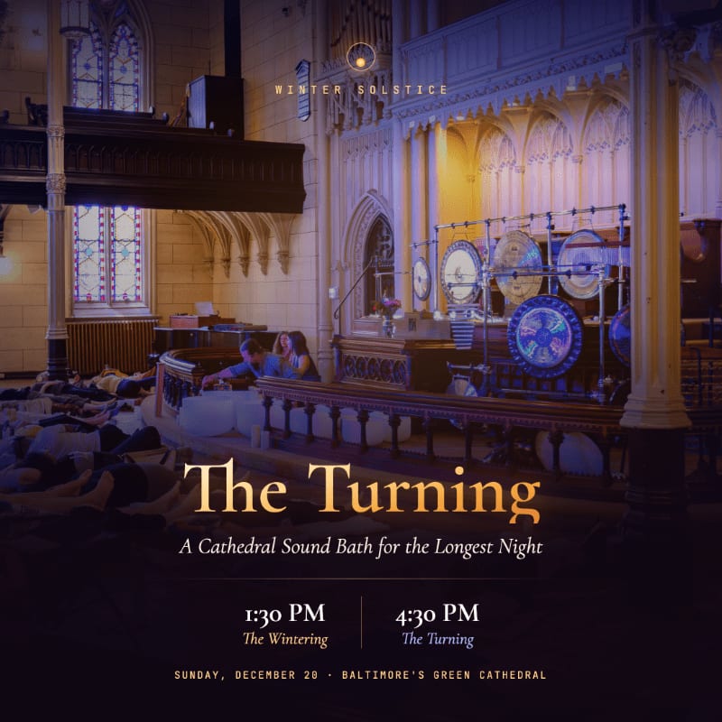 People lie on mats in the foreground of a gothic cathedral featuring ornate arches and large gongs in the background.