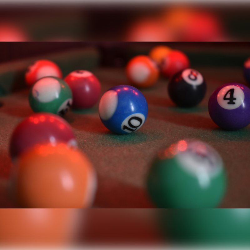 billiard balls on billiard table
