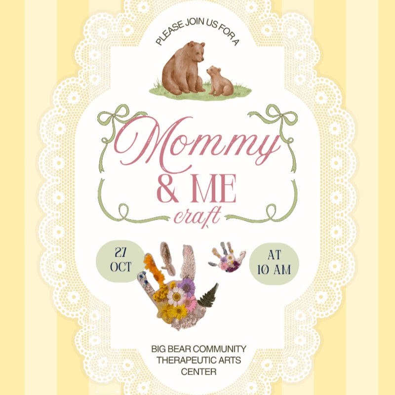 An invitation for a "Mommy & Me craft" event featuring bears and handprints in the foreground against a yellow striped background with a white lace border.