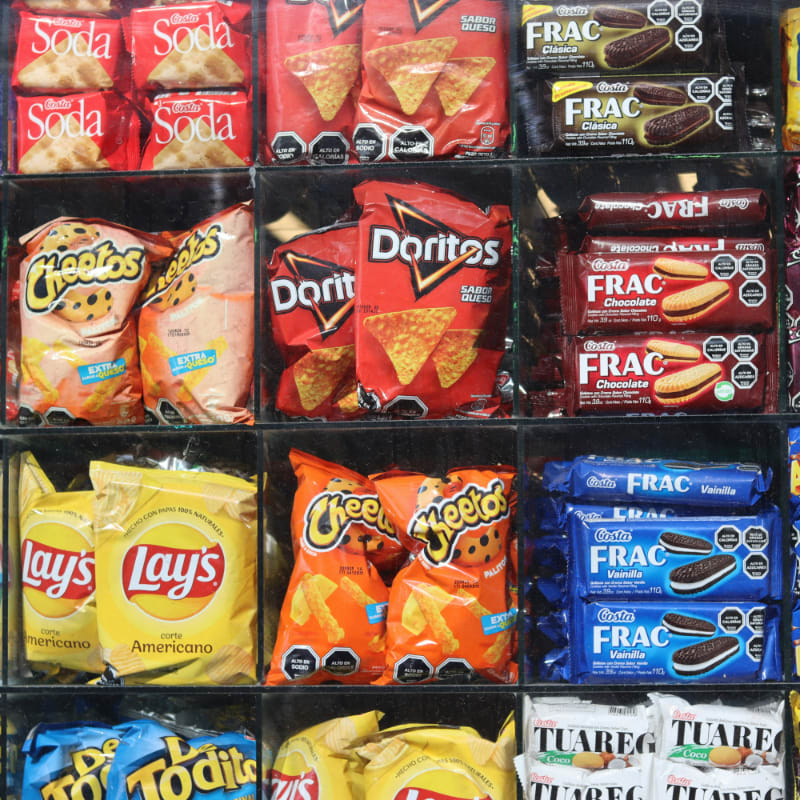 Shelves are filled with various snacks and drinks