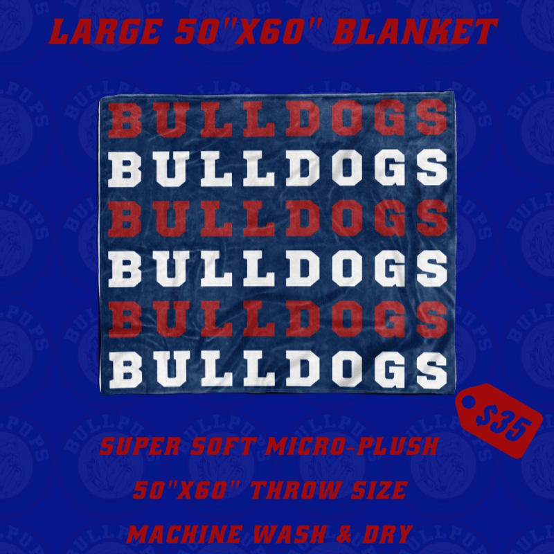 A blue blanket with repeating "BULLDOGS" text in red and white sits centered against a blue background featuring faded logos and orange promotional text.