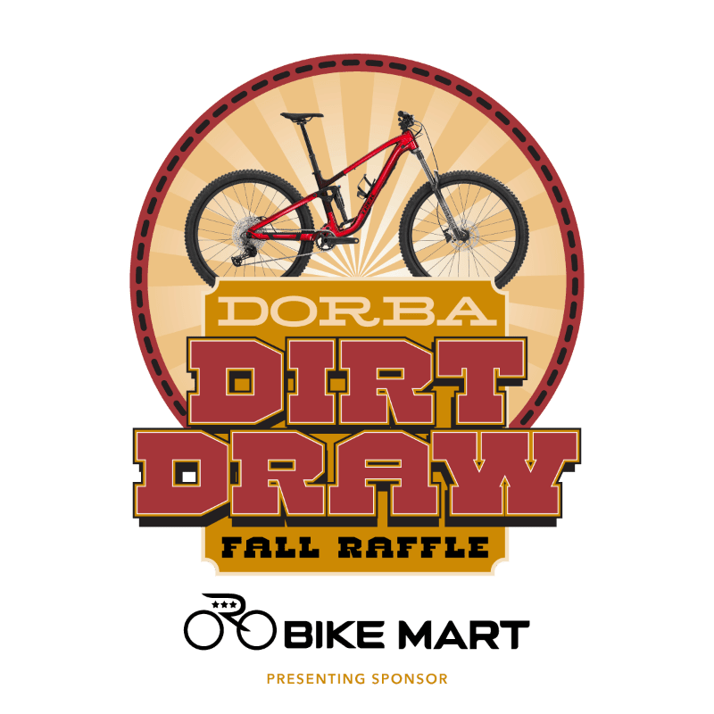 A red mountain bike sits centered within a circular emblem featuring a sunburst background, positioned above the bold text "DORBA DIRT DRAW FALL RAFFLE" and the Bike Mart logo.