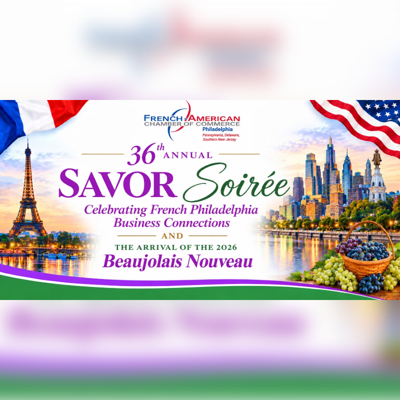A basket of grapes sits in the foreground of an event flyer featuring the Eiffel Tower and the Philadelphia skyline in the background.