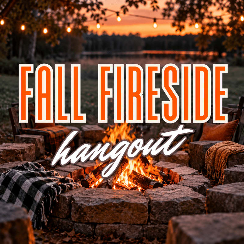A cozy stone fire pit with a crackling fire and blankets in the foreground sits before a serene lake and sunset background adorned with string lights.
