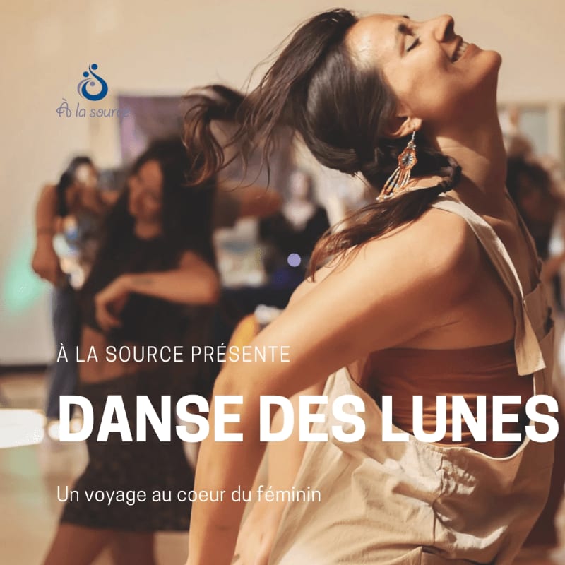 A woman dances joyfully in the foreground while other people dance in a blurred background.