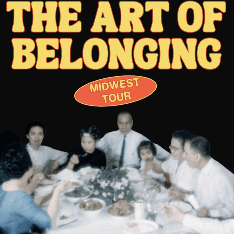 A family gathers around a dinner table in the foreground, set against a black background featuring the bold text "THE ART OF BELONGING" and a "MIDWEST TOUR" oval.
