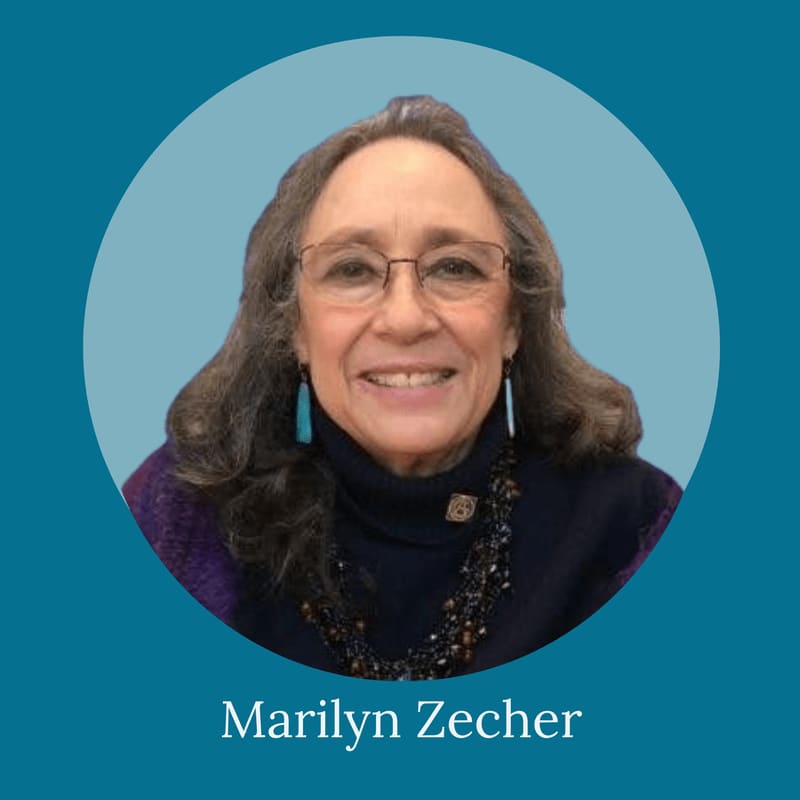 A smiling woman with glasses and a dark turtleneck is centered in a circular frame against a solid teal background.
