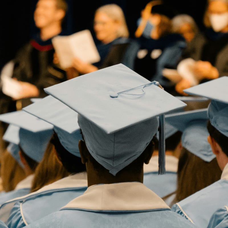 a group of people in graduation caps and gowns