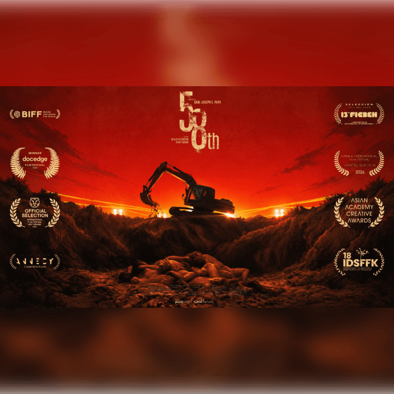 A pile of bodies lies in the foreground beneath an excavator on a mound of earth against a deep red sky.