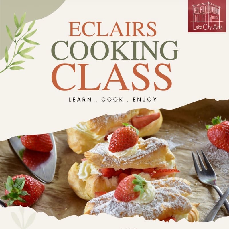 Fresh strawberry eclairs sit on brown parchment paper in the foreground, set against a light-colored background featuring text for a cooking class.