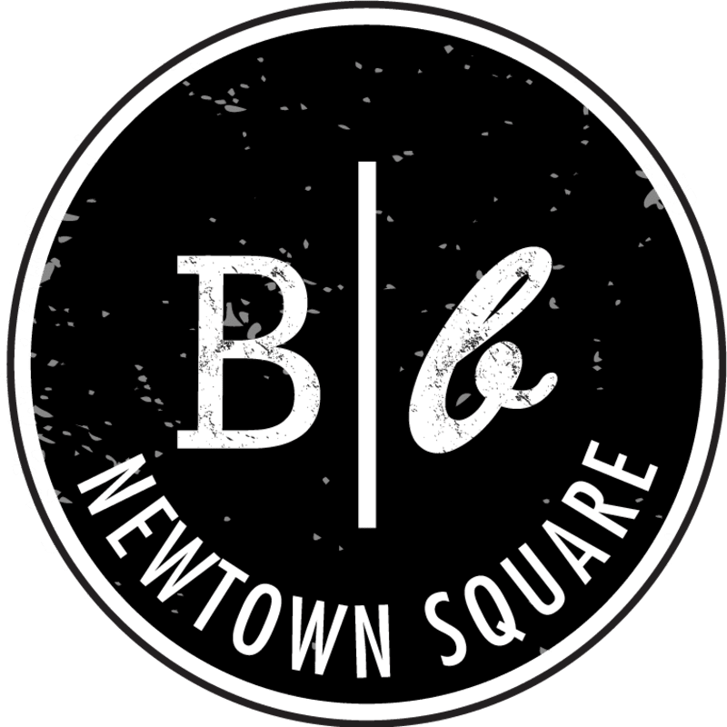 A white logo featuring the letters "B & b" and the text "NEWTOWN SQUARE" is centered on a distressed black circular background.