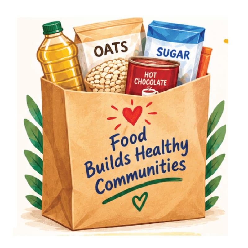 A brown paper bag filled with groceries and labeled "Food Builds Healthy Communities" sits against a background of green leaves.