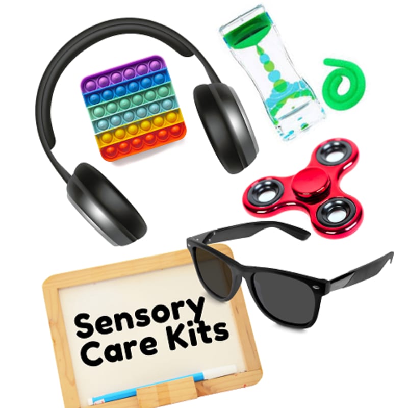 A collection of sensory tools, including noise-canceling headphones, a fidget spinner, and sunglasses, surrounds a small whiteboard labeled "Sensory Care Kits" against a plain white background.