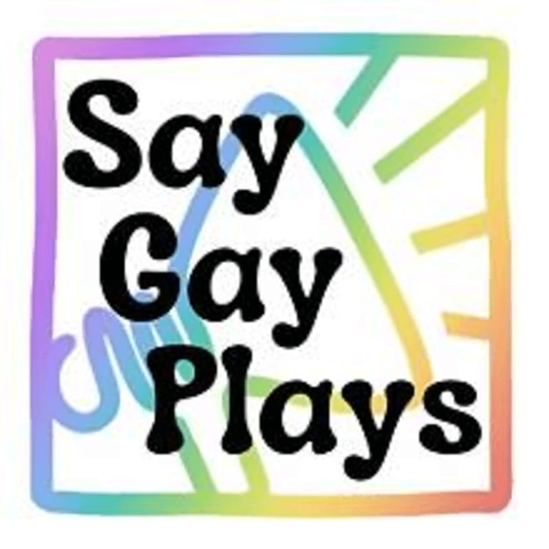 Black text reading "Say Gay Plays" sits in the foreground over a rainbow-colored microphone and border on a white background.