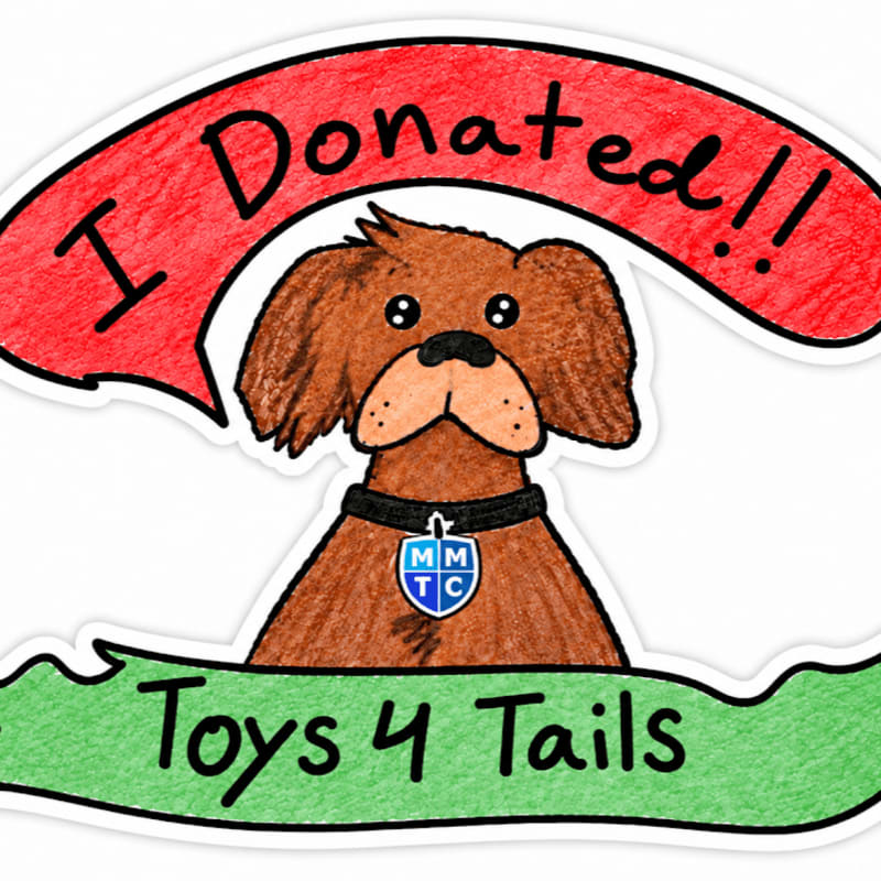 A brown dog wearing a blue collar tag stands in the foreground, framed by a red banner saying "I Donated!!" above and a green banner saying "Toys 4 Tails" below against a white background.