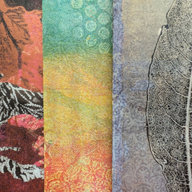 Three vertical textured panels feature an orange and red leaf pattern on the left, a green and yellow gradient in the center, and a grey leaf skeleton on the right.
