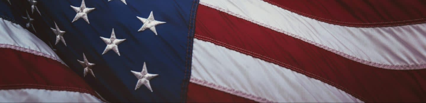 us a flag on white and red striped textile