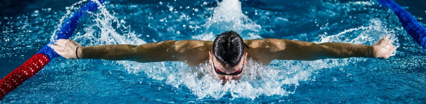 man doing butterfly stroke