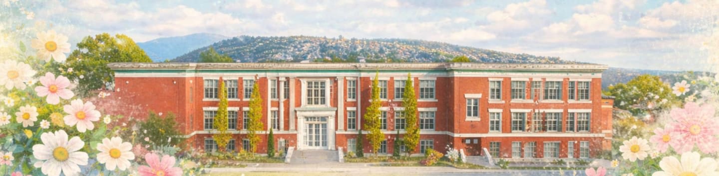 A red brick building with a white entrance stands before a hazy mountain range, framed by soft, pastel flowers.