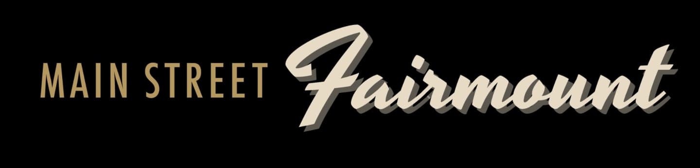 The words "MAIN STREET" in a sans-serif font are on the left, and "Fairmount" in a script font is on the right, both against a black background.