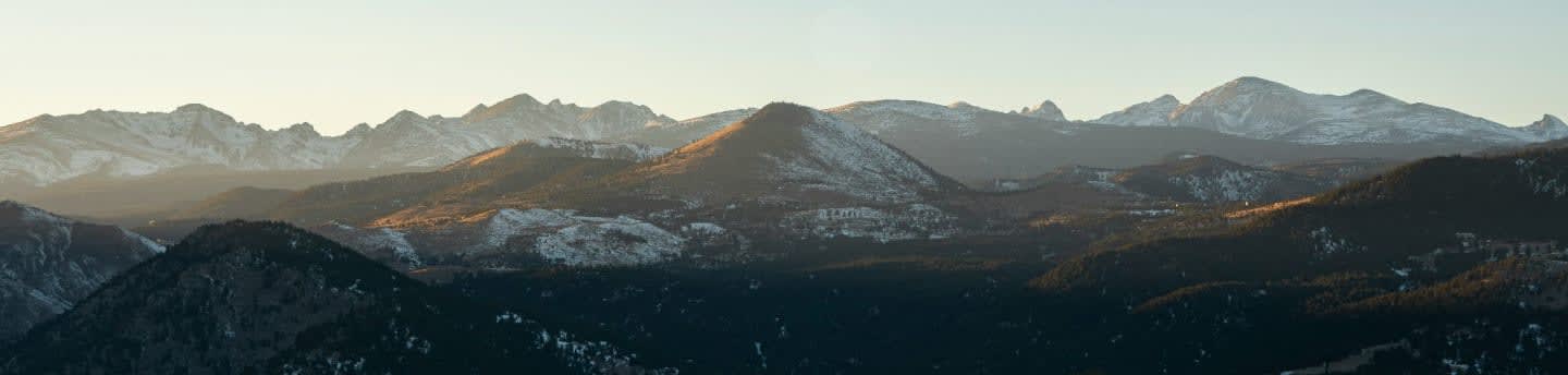 brown and black mountains under blue sky during daytime