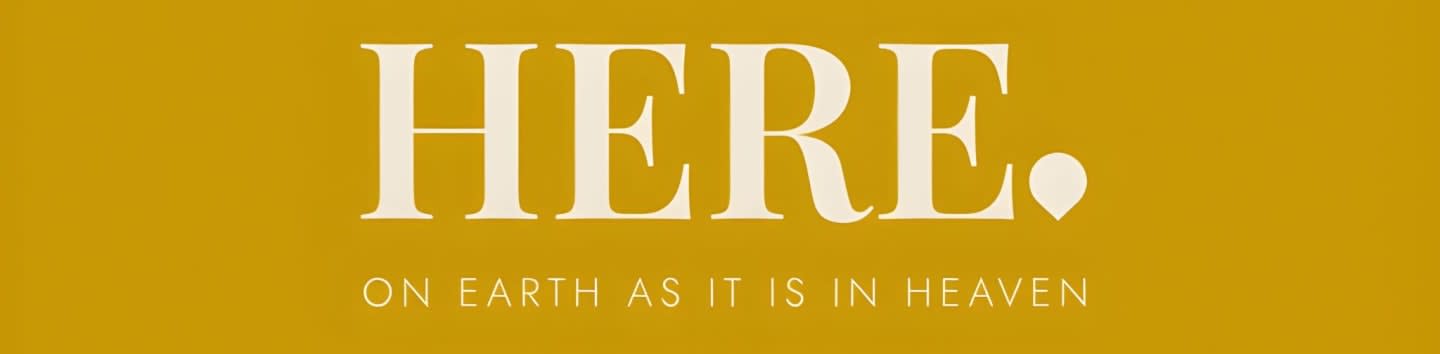 Large, cream-colored letters spelling "HERE" with a small dot and a heart shape appear on a mustard-yellow background, with smaller text below reading "ON EARTH AS IT IS IN HEAVEN."