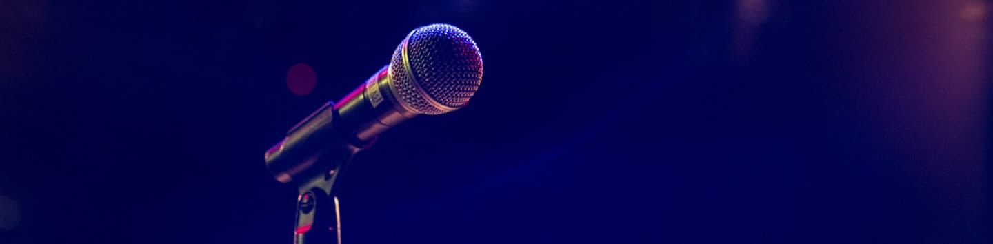 black and gray microphone on black stand
