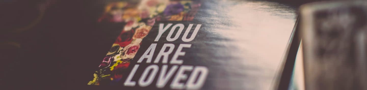 selective focus photography of You Are Loved book