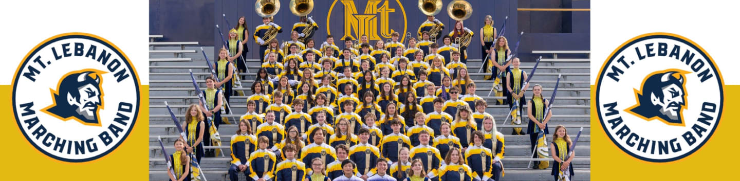 A large marching band in yellow and black uniforms poses on bleachers in front of a dark blue backdrop, flanked by circular logos of a devil's head.