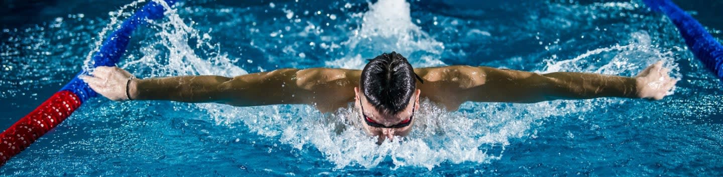 man doing butterfly stroke