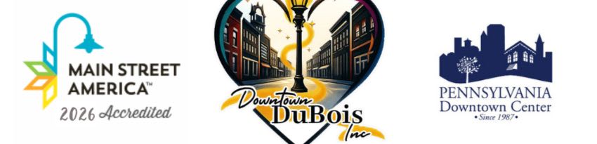 The foreground features logos for "Main Street America" and "Pennsylvania Downtown Center," while the background is a stylized depiction of a downtown street scene with a lamppost.