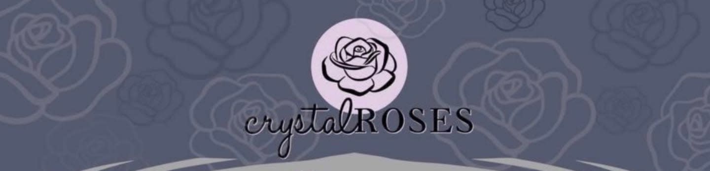 A pink rose logo with the text "crystal ROSES" is centered on a dark blue background with a subtle rose pattern.