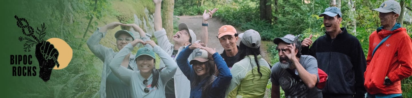 A group of people pose for a photo in a forest with a "BIPOC ROCKS" logo on the left.