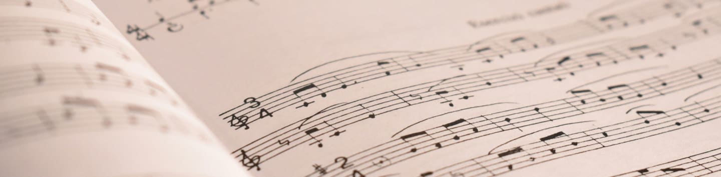 an open book with musical notes on it