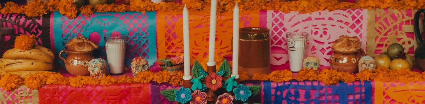 a table topped with lots of food and candles