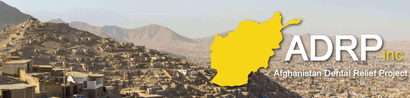A yellow map of Afghanistan and the text "ADRP inc. Afghanistan Dental Relief Project" are overlaid on a landscape of a hillside village with mountains in the background.