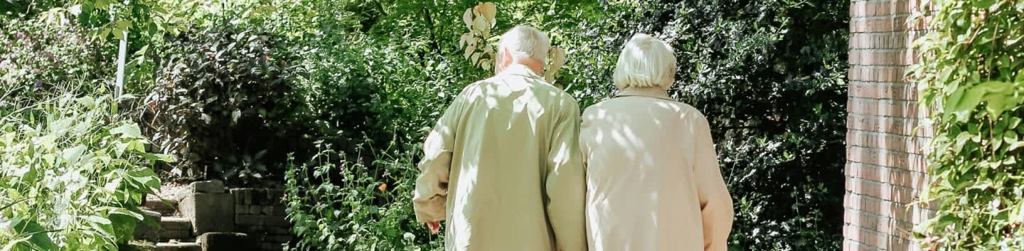 man and woman walking on road during daytime