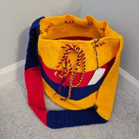 Yellow, Red, & Purple Bag w/draw strings by Lancheros item