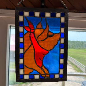 Stained glass panel of a pig in Blues and Reds item
