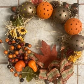 Decorative wreath with recycled pickleballs item