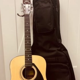 Acoustic guitar and case item