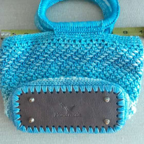 Hand-crocheted hand bag item
