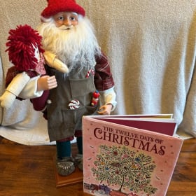 #6: Santa Figurine and Christmas Book item
