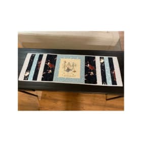 "Snowed in and Lovin' It" table runner item
