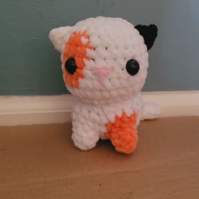White Crochet Cat with Black and Orange Spots item