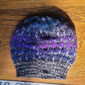 Blue Knitted Hat with Purple Accents item