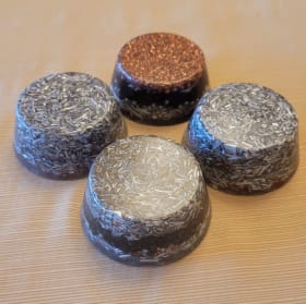 4 plain towerbusters placed in the four corners of your home item