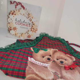 Holiday apron and cookie recipe book item
