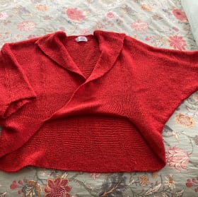 Bundle up in style with a red wrap cardigan and purple scarf item